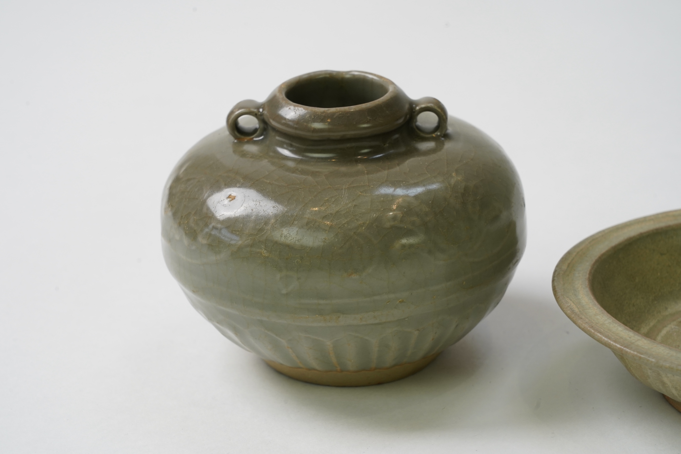 A group of four Chinese Celadon wares - two vases and two dishes, tallest vase 16cm.